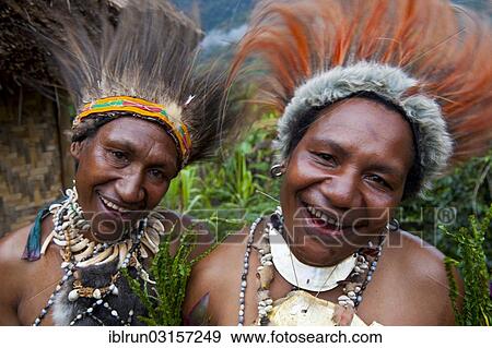 Stock Photo - "Women with colourful decorations are celebrating at the traditional Sing Sing gathering in the Highlands, Paya, Papua New Guinea, Oceania". Fotosearch
