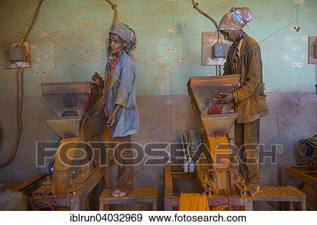 Stock Photo - "Women working in a Berbere red pepper spice factory at the Medebar market, Asmara, Eritrea, Africa". Fotosearch