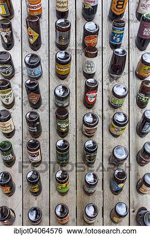 "Wooden board with many beer bottles of different brands of beer at a shop, Ypres, West Flanders, Belgium, Europe" View Large Photo Image Stock Photograph - "Wooden board with many beer bottles of different brands of beer at a shop, Ypres, West Flanders, Belgium, Europe". Fotosearch