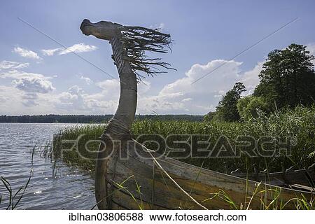 "Wooden boat with a horse's head, Mazurski Eden or Masurian Garden of Eden, reconstruction of Galindian culture, Gmina Ruciane-Nida, Warmian-Masurian Voivodeship, Poland, Europe" View Large Photo Image Stock Photo - "Wooden boat with a horse's head, Mazurski Eden or Masurian Garden of Eden, reconstruction of Galindian culture, Gmina Ruciane-Nida, Warmian-Masurian Voivodeship, Poland, Europe". Fotosearch