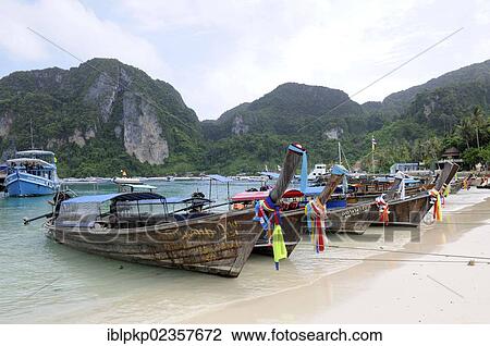 "Wooden boats on Phi Phi Island, Krabi, Thailand, Asia" View Large Photo Image Stock Image - "Wooden boats on Phi Phi Island, Krabi, Thailand, Asia". Fotosearch