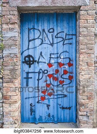 "Wooden door covered in graffiti, Teguier, Brittany, France, Europe" View Large Photo Image Stock Photograph - "Wooden door covered in graffiti, Teguier, Brittany, France, Europe". Fotosearch