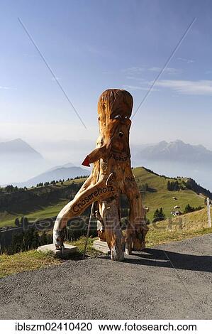 "Wooden figure as a guide to a cheese factory, Rigi, Switzerland, Europe" View Large Photo Image Stock Image - "Wooden figure as a guide to a cheese factory, Rigi, Switzerland, Europe". Fotosearch