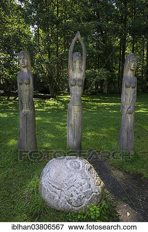 Stock Photo - "Wooden figures and a stone sculpture, Mazurski Eden or Masurian Garden of Eden, reconstruction of Galindian culture, Gmina Ruciane-Nida, Warmian-Masurian Voivodeship, Poland, Europe". Fotosearch