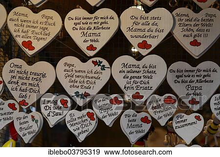 "Wooden hearts with sayings in German, souvenirs at a Christmas market, Baden-Wurttemberg, Germany, Europe" View Large Photo Image Stock Photo - "Wooden hearts with sayings in German, souvenirs at a Christmas market, Baden-Wurttemberg, Germany, Europe". Fotosearch