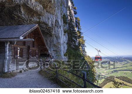 Stock Photo - "Wooden hut at the Wildkirchli Cave with a gondola of the Ebenalp cable car, Wasserauen, Appenzell Innerrhoden, Appenzell Inner Rhodes, Switzerland, Europe, PublicGround, Europe". Fotosearch