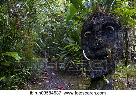 Stock Photo - "Wooden mask in a tribal village, Highlands, Papua New Guinea, Oceania". Fotosearch