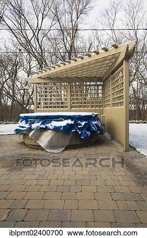 "Wooden pergola and a spa in a residential backyard covered up for the winter season, Quebec, Canada, North America" View Large Photo Image Stock Image - "Wooden pergola and a spa in a residential backyard covered up for the winter season, Quebec, Canada, North America". Fotosearch