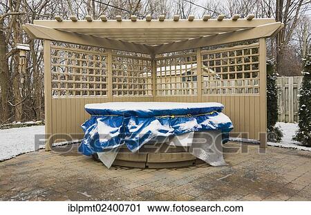 "Wooden pergola and a spa in a residential backyard covered up for the winter season, Quebec, Canada, North America" View Large Photo Image Stock Image - "Wooden pergola and a spa in a residential backyard covered up for the winter season, Quebec, Canada, North America". Fotosearch