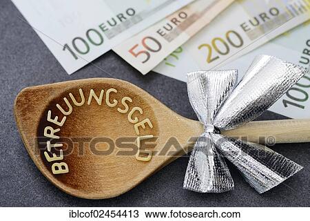 "Wooden spoon with the word Betreuungsgeld, German for carer's benefit, from pasta letters, next to euro banknotes" View Large Photo Image Stock Image - "Wooden spoon with the word Betreuungsgeld, German for carer's benefit, from pasta letters, next to euro banknotes". Fotosearch