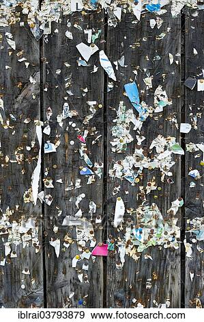"Wooden wall with poster scraps, tacks and staples, Germany, Europe" View Large Photo Image Stock Photo - "Wooden wall with poster scraps, tacks and staples, Germany, Europe". Fotosearch