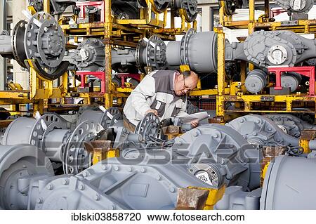 "Worker checking truck drive axles from MAN Truck and Bus AG, Munich, Upper Bavaria, Bavaria, Germany, Europe" View Large Photo Image Stock Image - "Worker checking truck drive axles from MAN Truck and Bus AG, Munich, Upper Bavaria, Bavaria, Germany, Europe". Fotosearch