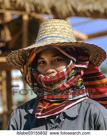 "Worker looking through the opening of a headscarf, sun protection, straw hat, concealed face, Thailand, Asia" View Large Photo Image Stock Image - "Worker looking through the opening of a headscarf, sun protection, straw hat, concealed face, Thailand, Asia". Fotosearch