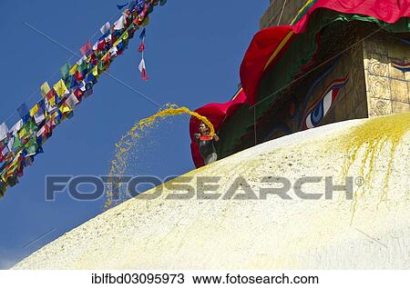 Stock Image - "Worker renewing the yellow paint of Boudnath Stupa, Kathmandu Valley, Kathmandu, Kathmandu District, Bagmati Zone, Nepal, Asia". Fotosearch