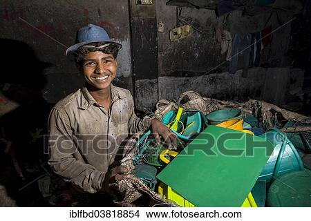 "Worker sorting out plastic garbage for recycling, Dharavi Slum, Mumbai, Maharashtra, India, Asia" View Large Photo Image Picture - "Worker sorting out plastic garbage for recycling, Dharavi Slum, Mumbai, Maharashtra, India, Asia". Fotosearch
