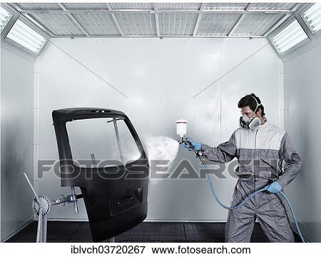 Stock Photo - "Worker spray-painting the door of a car boot, paint shop, car repair shop, St. Gertraudi, Reith im Alpbachtal, Kufstein District, North Tirol, Tirol, Austria, Europe". Fotosearch