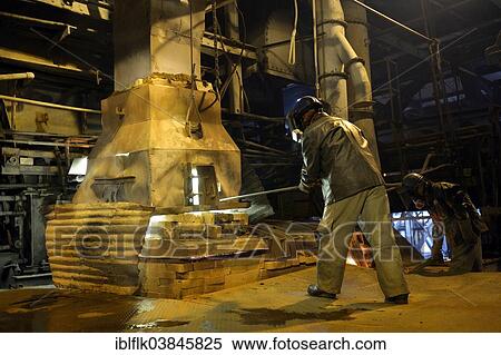 "Worker working at a melting furnace in the dated and derelict Doe Run ironworks, La Oroya, Junin, Peru, South America" View Large Photo Image Stock Photography - "Worker working at a melting furnace in the dated and derelict Doe Run ironworks, La Oroya, Junin, Peru, South America". Fotosearch