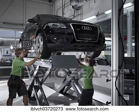 "Workers assembling panels to track wheel alignments, VW Strasser, Volkswagen car repair shop, St. Gertraudi, Reith im Alpbachtal, Kufstein District, North Tirol, Tirol, Austria, Europe" View Large Photo Image Stock Image - "Workers assembling panels to track wheel alignments, VW Strasser, Volkswagen car repair shop, St. Gertraudi, Reith im Alpbachtal, Kufstein District, North Tirol, Tirol, Austria, Europe". Fotosearch