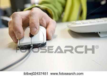 Workers hand on a computer scroll mouse. View Large Photo Image Stock Image - Workers hand on a computer scroll mouse.. Fotosearch