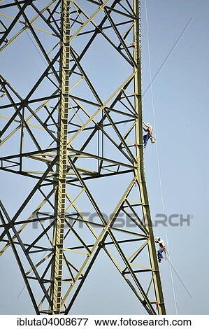 "Workers on a pylon, Bottrop, North Rhine-Westphalia, Germany, Europe" View Large Photo Image Stock Photo - "Workers on a pylon, Bottrop, North Rhine-Westphalia, Germany, Europe". Fotosearch