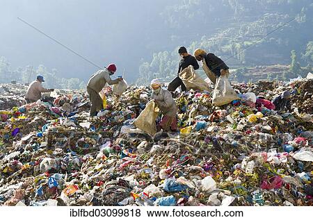 "Workers sorting out garbage at Aletar garbage dump, earning 300-400 nepali rupees a day, Aletar, Kathmandu District, Bagmati Zone, Nepal, Asia" View Large Photo Image Stock Photo - "Workers sorting out garbage at Aletar garbage dump, earning 300-400 nepali rupees a day, Aletar, Kathmandu District, Bagmati Zone, Nepal, Asia". Fotosearch
