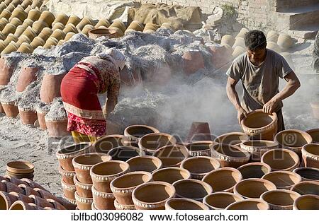 "Workers sorting out pottery after the burning process, Kathmandu Valley, Thimi, Kathmandu District, Bagmati Zone, Nepal, Asia" View Large Photo Image Stock Image - "Workers sorting out pottery after the burning process, Kathmandu Valley, Thimi, Kathmandu District, Bagmati Zone, Nepal, Asia". Fotosearch
