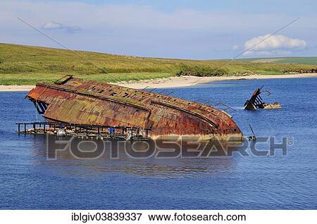 Stock Photo - "World War II boat intentionally sunk to protect the natural harbour of Scapa Flow, South Ronaldsay, Orkney, Scotland, United Kingdom, Europe". Fotosearch
