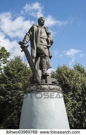 "World War II memorial, soldier with big sword in a heroic pose, holding a child, bronze sculpture on a pedestal, Tilsit, Sovetsk, Kaliningrad Oblast, Russia, Europe" View Large Photo Image Stock Photo - "World War II memorial, soldier with big sword in a heroic pose, holding a child, bronze sculpture on a pedestal, Tilsit, Sovetsk, Kaliningrad Oblast, Russia, Europe". Fotosearch