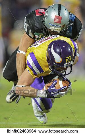 "WR Kyle Kaiser, No. 3 Vikings, is tackled by DB Markus Krause, No. 21 Raiders, final game of the Austrian Football League 2012 between the Vienna Vikings and the Swarco Raiders Tirol, Vienna, Austria, Europe" View Large Photo Image Picture - "WR Kyle Kaiser, No. 3 Vikings, is tackled by DB Markus Krause, No. 21 Raiders, final game of the Austrian Football League 2012 between the Vienna Vikings and the Swarco Raiders Tirol, Vienna, Austria, Europe". Fotosearch