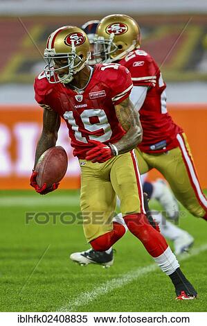 "WR Ted Ginn, #19 49ers, runs with the ball during the NFL International game between the San Francisco 49ers and the Denver Broncos on October 31, 2010 in London, England, United Kingdom, Europe" View Large Photo Image Stock Photography - "WR Ted Ginn, #19 49ers, runs with the ball during the NFL International game between the San Francisco 49ers and the Denver Broncos on October 31, 2010 in London, England, United Kingdom, Europe". Fotosearch