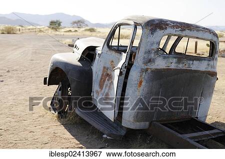 Stock Photo - Wrecked vintage car, Solitaire, Namibia, Africa. Fotosearch