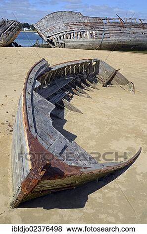 "Wrecks of two old wooden ships at the banks of river Etel, southern Brittany, Bretagne, France, Europe" View Large Photo Image Stock Photo - "Wrecks of two old wooden ships at the banks of river Etel, southern Brittany, Bretagne, France, Europe". Fotosearch