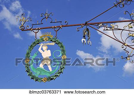 "Wrought iron hanging sign from the first half of the 18th century for the brewery restaurant """"Zum Wilden Mann"""", Dinkelsbuhl, Middle Franconia, Bavaria, Germany, Europe" View Large Photo Image Stock Image - "Wrought iron hanging sign from the first half of the 18th century for the brewery restaurant """"Zum Wilden Mann"""", Dinkelsbuhl, Middle Franconia, Bavaria, Germany, Europe". Fotosearch