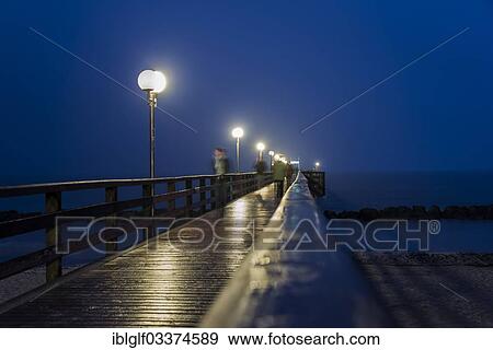 "Wustrow Pier at night, Wustrow, Mecklenburg-Western Pomerania, Germany, Europe" View Large Photo Image Stock Photo - "Wustrow Pier at night, Wustrow, Mecklenburg-Western Pomerania, Germany, Europe". Fotosearch