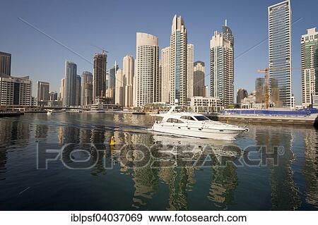 "Yacht in front of the skyscrapers of Dubai Marina, Dubai, United Arab Emirates, Asia" View Large Photo Image Stock Photo - "Yacht in front of the skyscrapers of Dubai Marina, Dubai, United Arab Emirates, Asia". Fotosearch