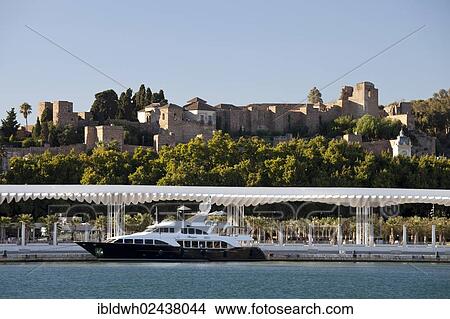 "Yacht in the harbour, the Moorish fortress of Alcazaba at the back, Malaga, Costa del Sol, Andalusia, Spain, Europe, PublicGround, Europe" View Large Photo Image Picture - "Yacht in the harbour, the Moorish fortress of Alcazaba at the back, Malaga, Costa del Sol, Andalusia, Spain, Europe, PublicGround, Europe". Fotosearch
