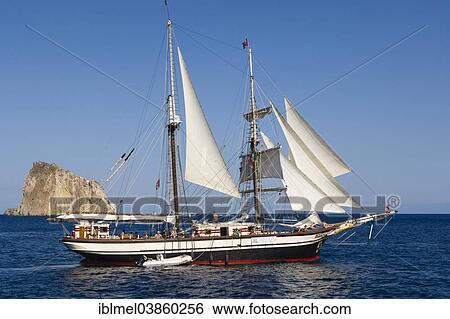 "Yacht sailing off Isola Dattilo, volcanic island, Tyrrhenian Sea, Aeolian Islands, Sicily, Italy, Europe" View Large Photo Image Stock Photograph - "Yacht sailing off Isola Dattilo, volcanic island, Tyrrhenian Sea, Aeolian Islands, Sicily, Italy, Europe". Fotosearch