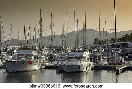 "Yachts in the evening light, marina of Puerto Calero, Lanzarote, Canary Islands, Spain, Europe" View Large Photo Image Stock Photograph - "Yachts in the evening light, marina of Puerto Calero, Lanzarote, Canary Islands, Spain, Europe". Fotosearch