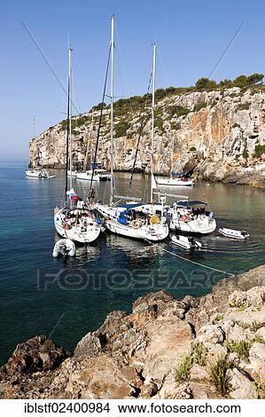 "Yachts moored in the bay of Cales Coves, South Menorca, Menorca Island, Balearic Islands, Spain, Southern Europe, Europe" View Large Photo Image Picture - "Yachts moored in the bay of Cales Coves, South Menorca, Menorca Island, Balearic Islands, Spain, Southern Europe, Europe". Fotosearch
