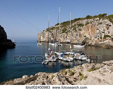 "Yachts moored in the bay of Cales Coves, South Menorca, Menorca Island, Balearic Islands, Spain, Southern Europe, Europe" View Large Photo Image Stock Image - "Yachts moored in the bay of Cales Coves, South Menorca, Menorca Island, Balearic Islands, Spain, Southern Europe, Europe". Fotosearch