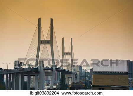 Picture - "Yangpu Bridge at sunset, Shanghai, China, Asia". Fotosearch