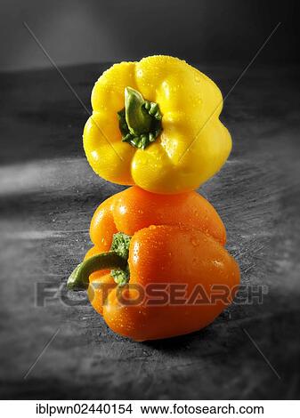 Yellow and orange bell peppers View Large Photo Image Picture - Yellow and orange bell peppers. Fotosearch