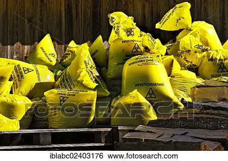 Stock Photograph - "Yellow bags with infectious waste, Bavaria, Germany, Europe". Fotosearch