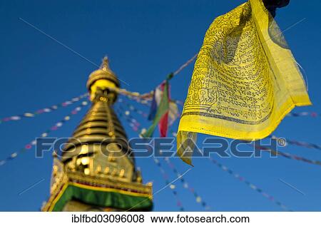 Stock Photo - "Yellow Buddhist prayer flag with Swayambhunath Stupa, Monkey Temple, Kathmandu Valley, Kathmandu, Kathmandu District, Bagmati Zone, Nepal, Asia". Fotosearch