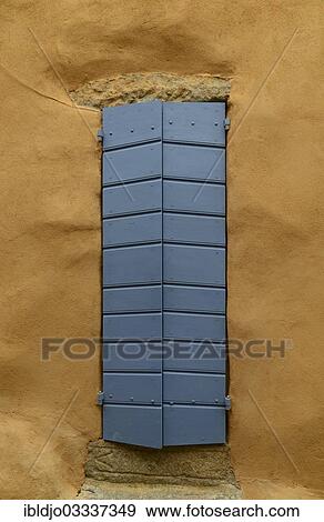 "Yellow house wall and a closed blue door, Pigna, Corsica, France, Europe" View Large Photo Image Stock Photo - "Yellow house wall and a closed blue door, Pigna, Corsica, France, Europe". Fotosearch