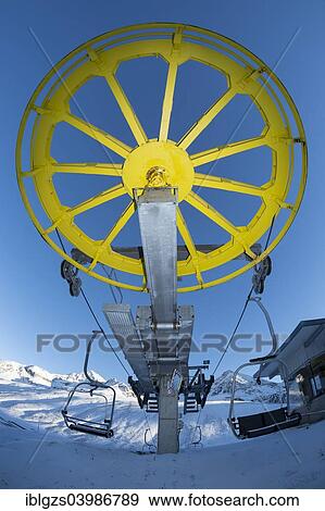 "Yellow return bullwheel at terminus, chairlift, Kuhtai ski region, Tyrol, Austria, Europe" View Large Photo Image Stock Photo - "Yellow return bullwheel at terminus, chairlift, Kuhtai ski region, Tyrol, Austria, Europe". Fotosearch
