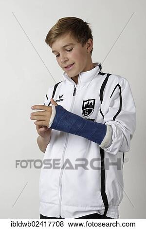 Stock Photo - Young athlete with an arm injury. Fotosearch