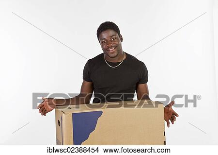 Young black man with moving boxes View Large Photo Image Picture - Young black man with moving boxes. Fotosearch