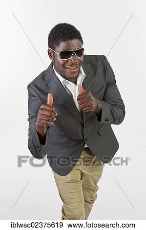 Young black man with sunglasses giving a thumbs up View Large Photo Image Stock Photo - Young black man with sunglasses giving a thumbs up. Fotosearch