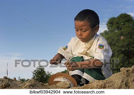 "Young boy flying a kite, Irrawaddy, Mandalay, Mandalay District, Myanmar, Asia" View Large Photo Image Picture - "Young boy flying a kite, Irrawaddy, Mandalay, Mandalay District, Myanmar, Asia". Fotosearch